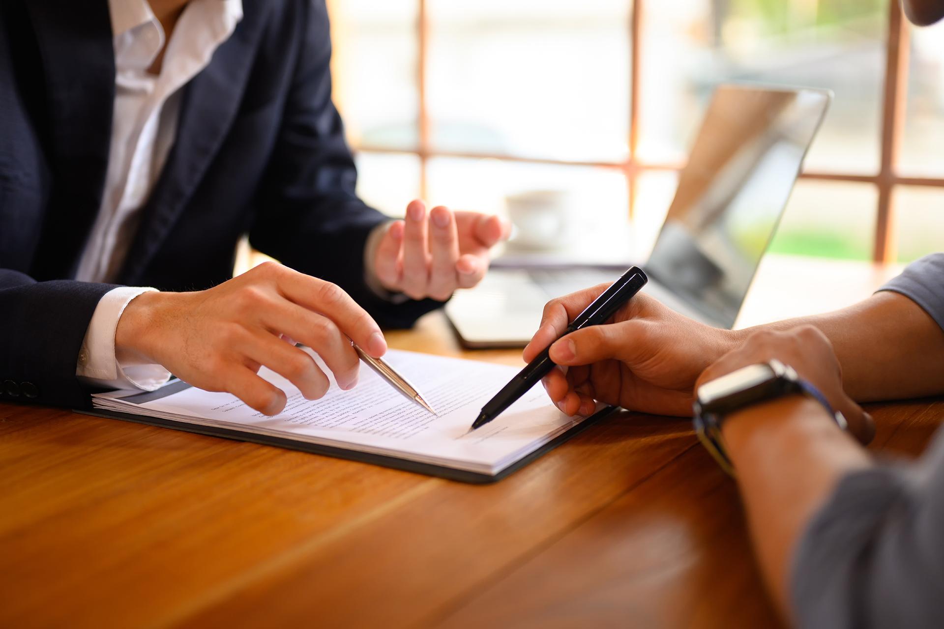 Two people reviewing paperwork